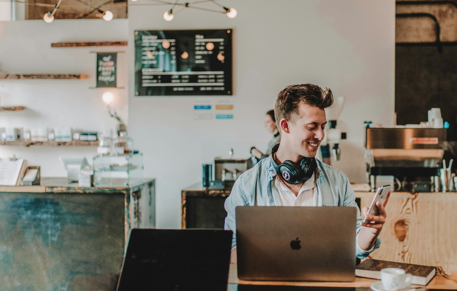 New business owner in Saudi Arabia setting up an online presence on a laptop